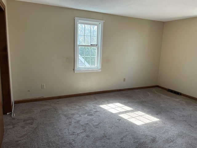 18 Russo Rd, West Yarmouth, MA 02673 - unfurnished room featuring carpet flooring, visible vents, and baseboards