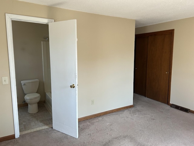 18 Russo Rd, West Yarmouth, MA 02673 - unfurnished bedroom with a closet, visible vents, baseboards, and carpet