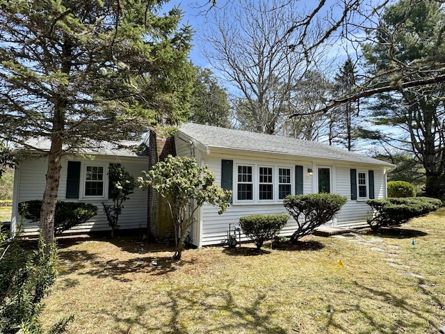56 Wendward Way W, Yarmouth, MA 02673 - view of front of house with a chimney and a front lawn