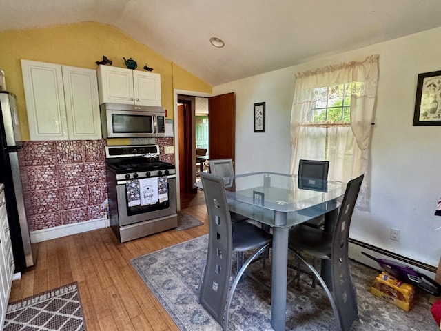 56 Wendward Way W, Yarmouth, MA 02673 - dining area featuring vaulted ceiling and hardwood / wood-style floors