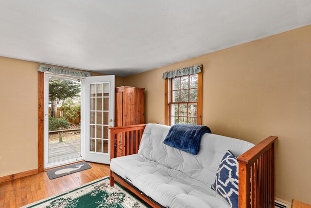 52 Nauset Rd, West Yarmouth, MA 02673 - living area with hardwood / wood-style floors, baseboards, and baseboard heating