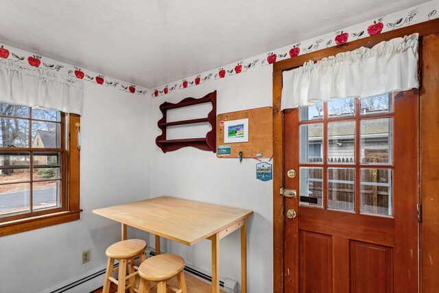 52 Nauset Rd, West Yarmouth, MA 02673 - dining area with a baseboard heating unit