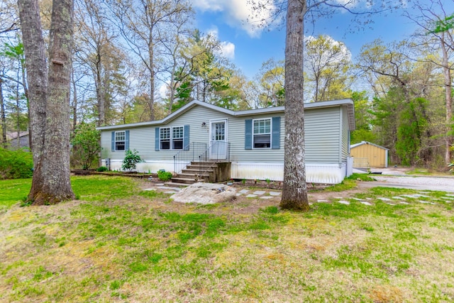 248 Mattapoisett Rd, Acushnet, MA 02743 - manufactured / mobile home with an outdoor structure and a front yard