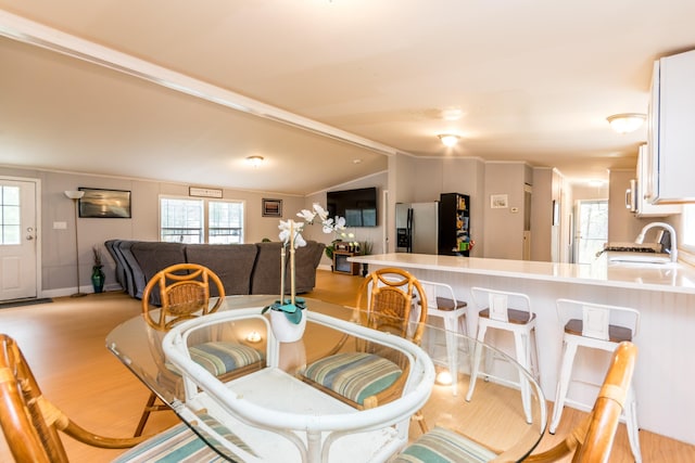 248 Mattapoisett Rd, Acushnet, MA 02743 - dining space featuring healthy amount of natural light, wood finished floors, and vaulted ceiling