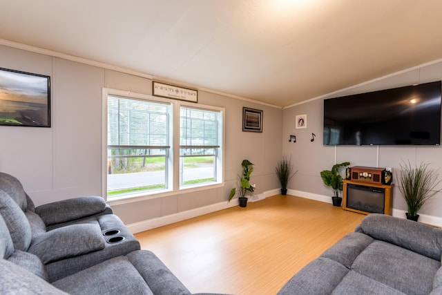 248 Mattapoisett Rd, Acushnet, MA 02743 - living area with light wood-style flooring, baseboards, and ornamental molding