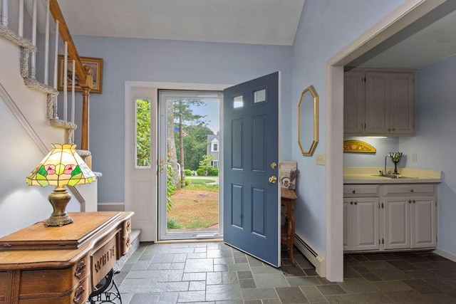 24 Indigo Ln, Osterville, MA 02655 - entrance foyer with stone tile floors and a baseboard heating unit