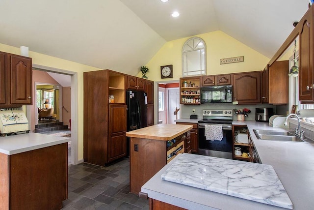 24 Indigo Ln, Osterville, MA 02655 - kitchen featuring open shelves, black appliances, a kitchen island, dark stone finish floors, and high vaulted ceiling