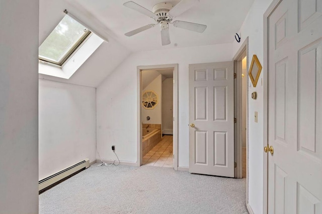 24 Indigo Ln, Osterville, MA 02655 - additional living space featuring a baseboard heating unit, a skylight, vaulted ceiling, carpet floors, and a ceiling fan