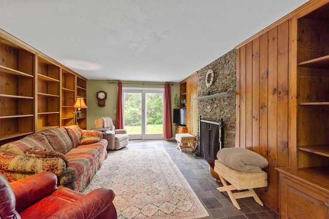 24 Indigo Ln, Osterville, MA 02655 - living area with wood walls and a stone fireplace