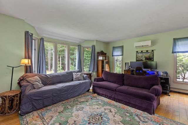 24 Indigo Ln, Osterville, MA 02655 - living room featuring a wall mounted AC, wood-type flooring, and vaulted ceiling