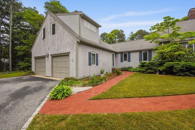 24 Indigo Ln, Osterville, MA 02655 - view of front of home with a front yard, driveway, a garage, and roof with shingles