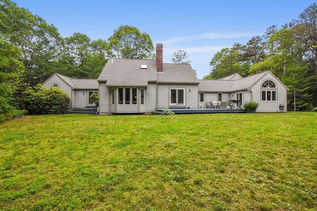 24 Indigo Ln, Osterville, MA 02655 - back of house featuring a wooden deck, a chimney, and a lawn