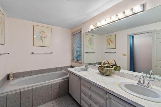 24 Indigo Ln, Osterville, MA 02655 - full bath featuring tile patterned flooring, double vanity, and a garden tub
