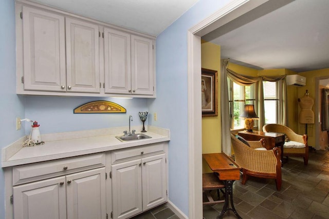 24 Indigo Ln, Osterville, MA 02655 - bar featuring a wall unit AC and dark stone finish floors