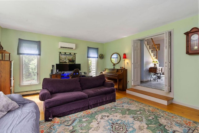 24 Indigo Ln, Osterville, MA 02655 - living room featuring a wall mounted air conditioner, a baseboard radiator, and wood finished floors