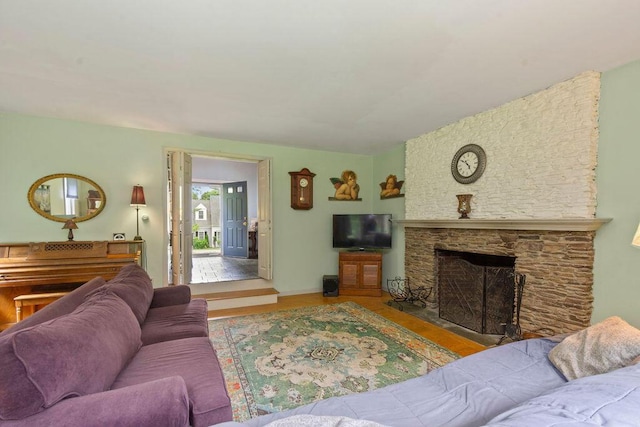 24 Indigo Ln, Osterville, MA 02655 - living room featuring wood finished floors and a stone fireplace
