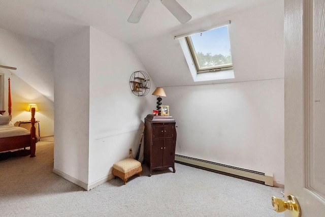 24 Indigo Ln, Osterville, MA 02655 - bedroom with baseboard heating, light carpet, a skylight, vaulted ceiling, and ceiling fan