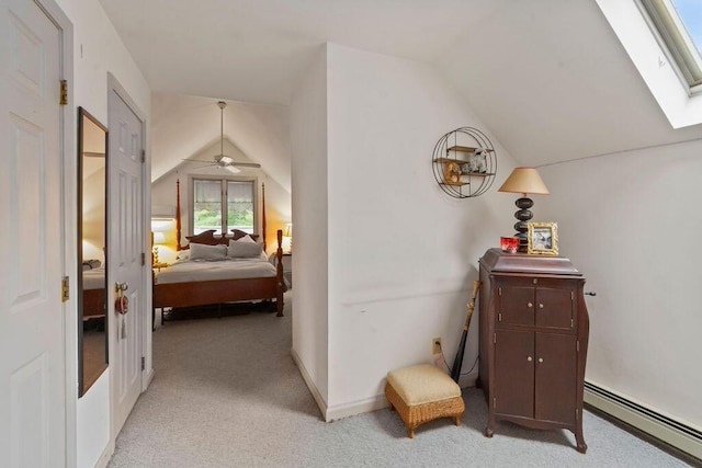 24 Indigo Ln, Osterville, MA 02655 - bedroom with baseboard heating, lofted ceiling, light carpet, and a skylight