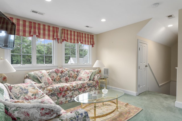 living area with visible vents and carpet flooring