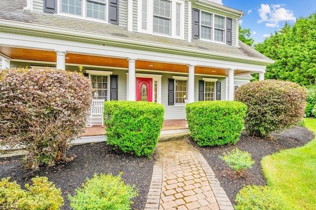 doorway to property featuring covered porch