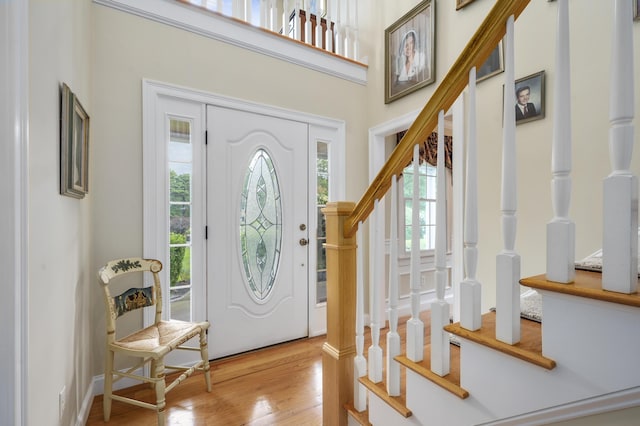 foyer with stairway and wood finished floors