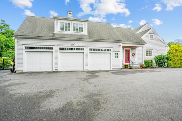 view of front of home featuring a shingled roof