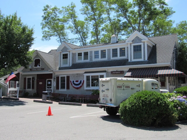 91 Depot St Unit 10, Dennis Port, MA 02639 - view of front facade featuring uncovered parking and roof with shingles