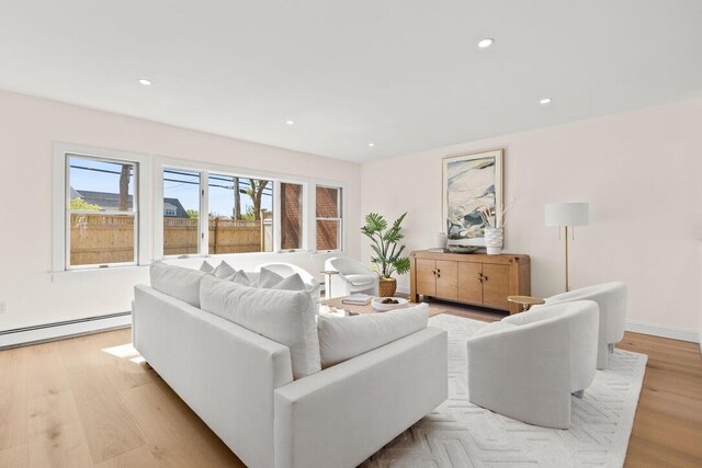 354 Gifford St Unit 1, Falmouth, MA 02540 - living area with a baseboard radiator, light wood-type flooring, and recessed lighting