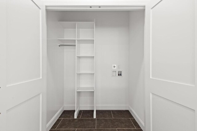 354 Gifford St Unit 1, Falmouth, MA 02540 - washroom with hookup for a washing machine, baseboards, dark tile patterned flooring, and hookup for an electric dryer