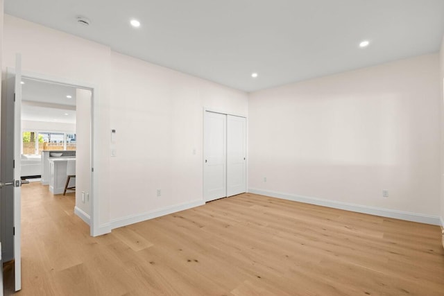 354 Gifford St Unit 1, Falmouth, MA 02540 - unfurnished bedroom with light wood-type flooring, baseboards, and recessed lighting