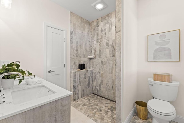 354 Gifford St Unit 1, Falmouth, MA 02540 - bathroom with a sink, toilet, a walk in shower, and baseboards
