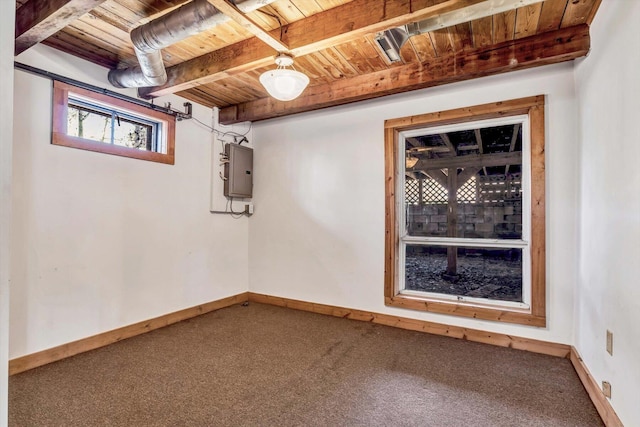 below grade area featuring baseboards, carpet floors, wood ceiling, and electric panel