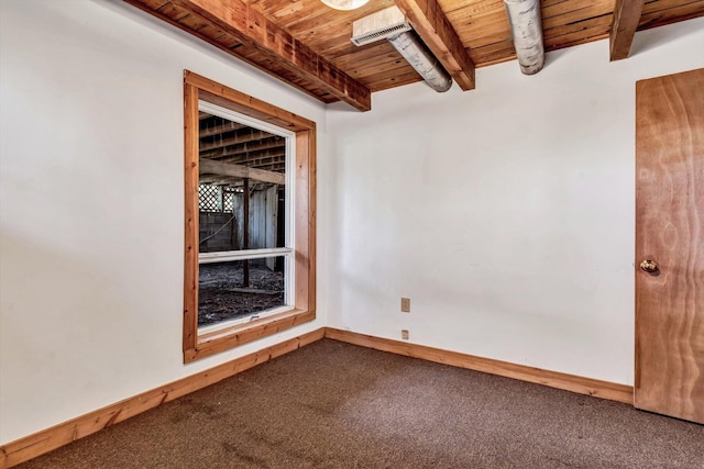 empty room featuring carpet, beamed ceiling, and wooden ceiling