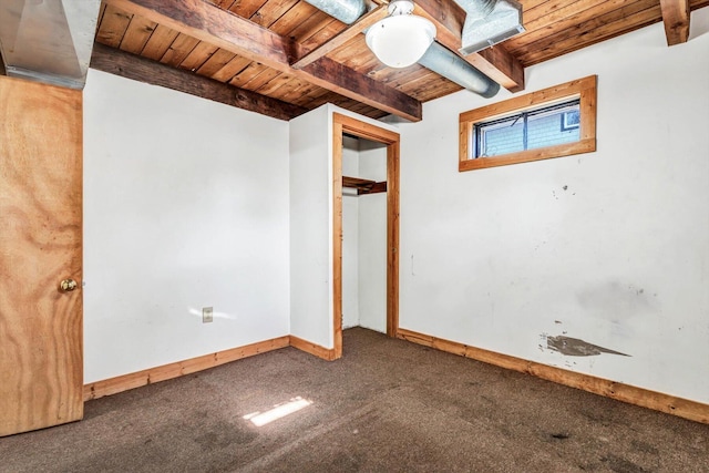 interior space with wooden ceiling, carpet flooring, and baseboards