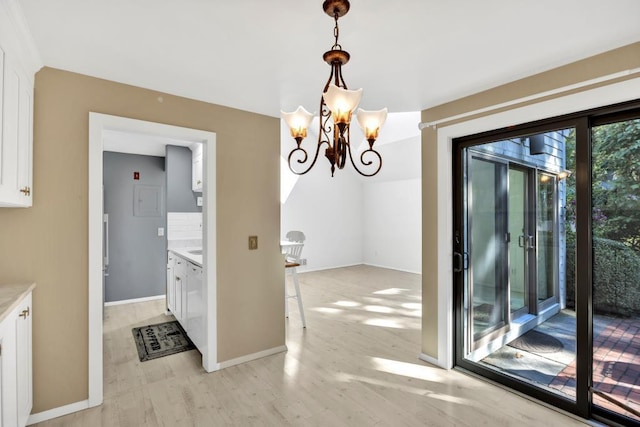 unfurnished dining area with a notable chandelier