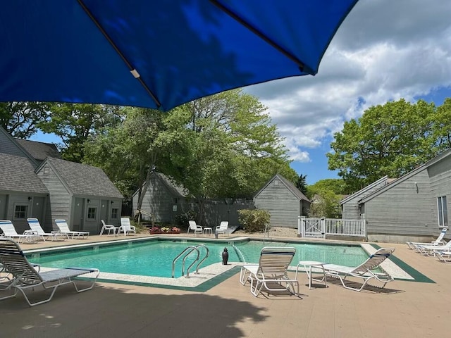 view of swimming pool featuring a patio area