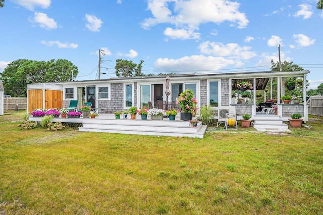 16 Gulls Cove Rd, West Yarmouth, MA 02673 - back of house with a wooden deck
