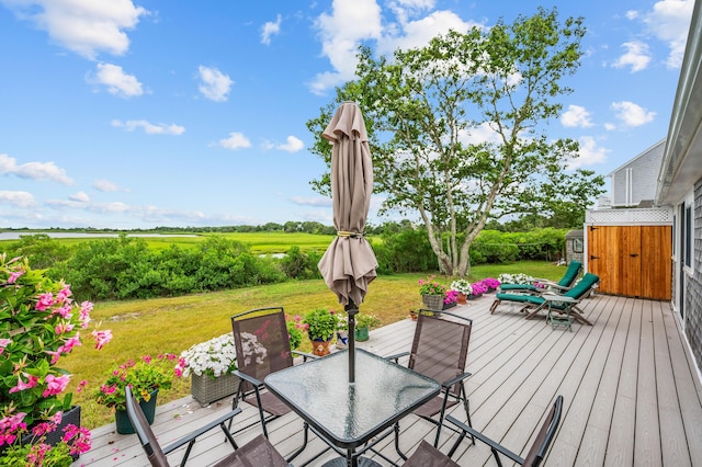 16 Gulls Cove Rd, West Yarmouth, MA 02673 - wooden terrace featuring outdoor dining area and a yard