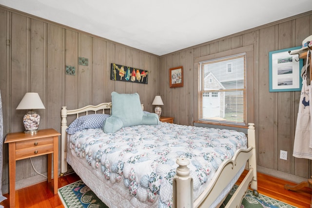 16 Gulls Cove Rd, West Yarmouth, MA 02673 - bedroom featuring wood finished floors and wood walls