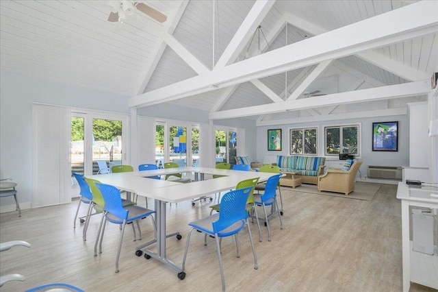 sunroom featuring french doors and beamed ceiling