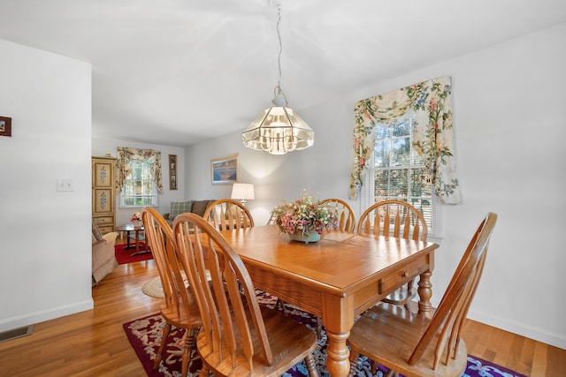 dining area with light wood-type flooring