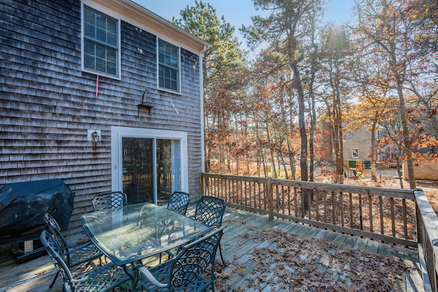 wooden terrace featuring grilling area