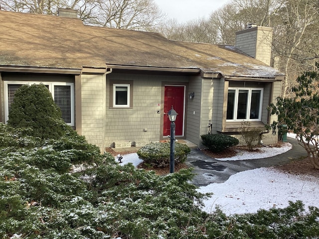 view of snow covered property entrance