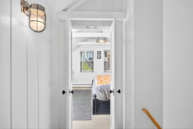 7 Anthony St, Provincetown, MA 02657 - corridor featuring vaulted ceiling and a baseboard radiator