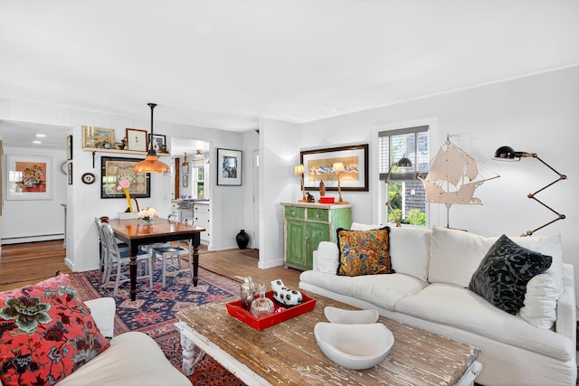 7 Anthony St, Provincetown, MA 02657 - living room featuring a baseboard heating unit and wood finished floors