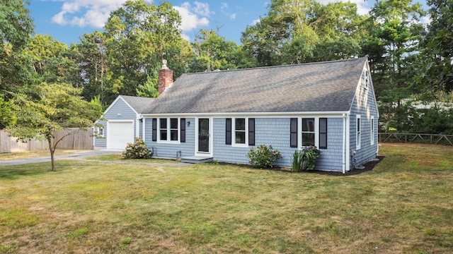 view of front facade with a garage and a front lawn