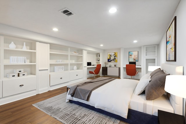 bedroom featuring wood-type flooring and built in desk