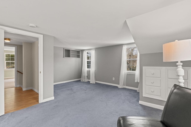 home office featuring a healthy amount of sunlight and carpet flooring