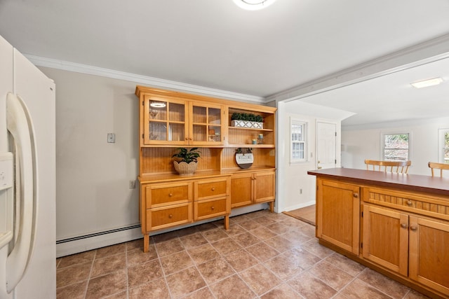 kitchen with crown molding, a baseboard radiator, and white fridge with ice dispenser