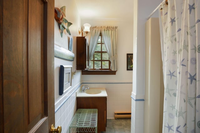 83 Colonial Way W, Falmouth, MA 02540 - full bath with tile walls, wainscoting, tile patterned flooring, vanity, and a shower with shower curtain